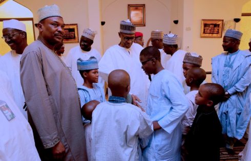 President Muhammadu Buhari interacts with children after Juma'at prayer at the Aso Villa in Abuja. PHOTO; SUNDAY AGHAEZE. APRIL 21 2017.