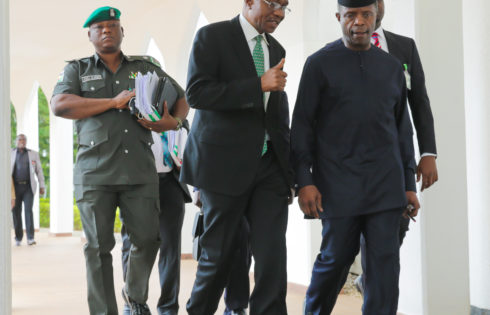 L-R; CBN Governor, Mr Godwin Emefiele confers with the Acting President Yemi Osinbajo after the National Economic Council (NEC) Meeting held at the Council Chamber State House in Abuja. PHOTO; SUNDAY AGHAEZE. MAY 25 2017