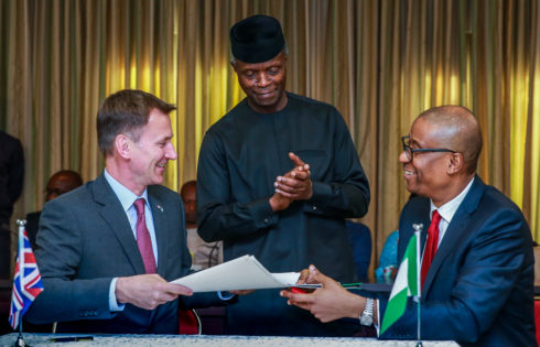 VP Osinbajo with Minister of Industry, Trade, and Investment, Mr. Okechukwu Enelamah (R); UK Foreign Secretary, Mr. Jeremy Hunt (L) witnessing the signing of a communique of the first Nigeria-UK Economic Development Forum