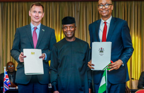 VP Osinbajo with Minister of Industry, Trade, and Investment, Mr. Okechukwu Enelamah (R); UK Foreign Secretary, Mr. Jeremy Hunt (L) witnessing the signing of a communique of the first Nigeria-UK Economic Development Forum